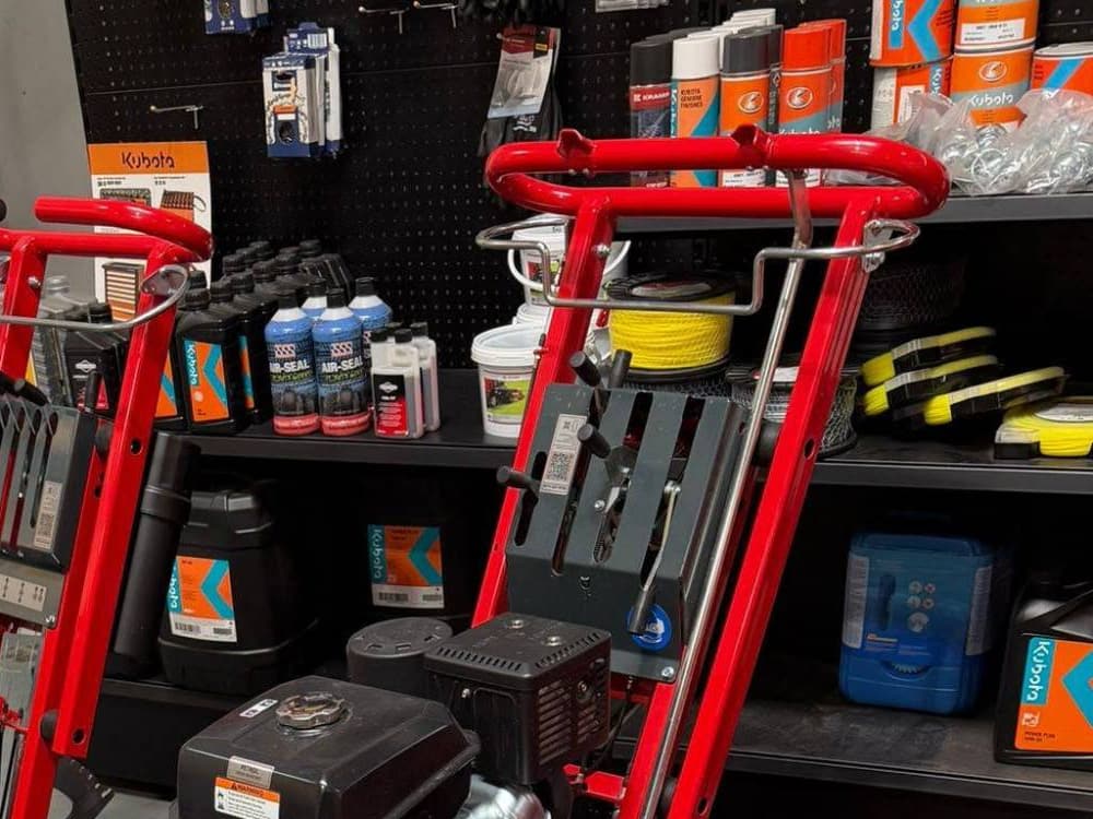 Workshop shelves at Unit 11 stocked with Kubota, Sparex and Briggs & Stratton oils, filters and consumables